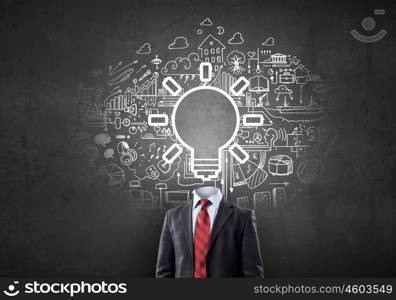 Head full of ideas. Unrecognizable businessman with light bulb instead of head