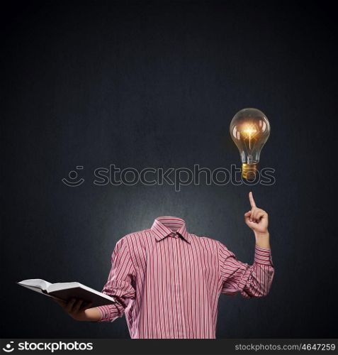 Head full of ideas. Unrecognizable businessman with light bulb instead of head