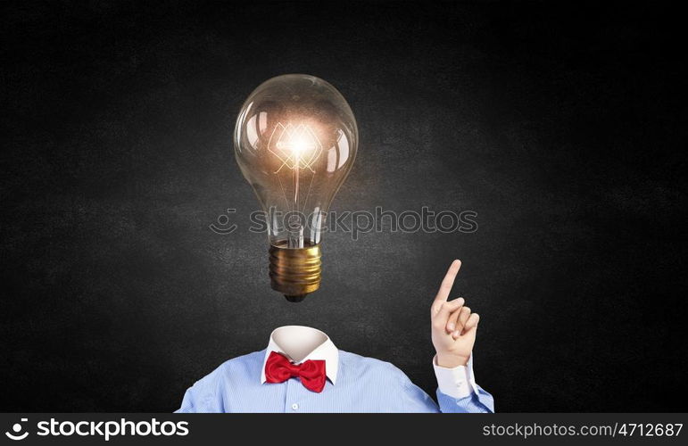 Head full of ideas. Unrecognizable businessman with light bulb instead of head