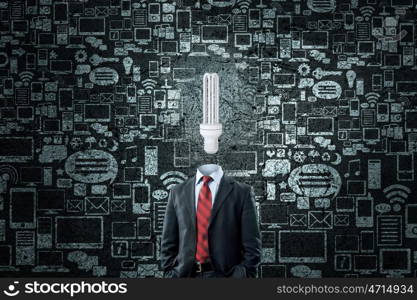 Head full of ideas. Unrecognizable businessman with light bulb instead of head