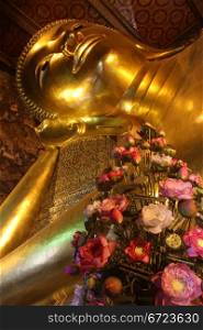 Head of sleeping Buddha in wat Pho, Bangkok, Thailand