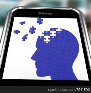 . Head Puzzle On Smartphone Shows Smartness And Brightness