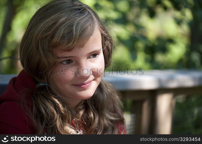 Head shot of a young girl with the sunlight on her face