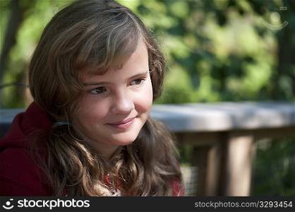 Head shot of a young girl with the sunlight on her face