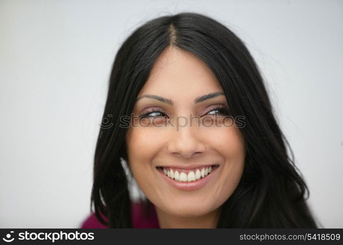 Head-shot of happy brunette