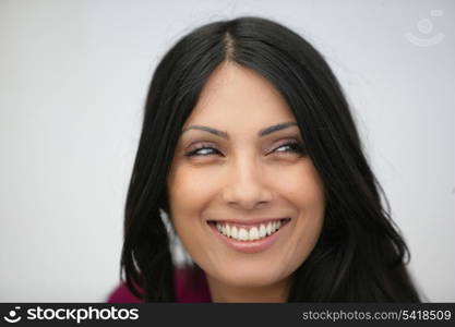 Head-shot of happy brunette