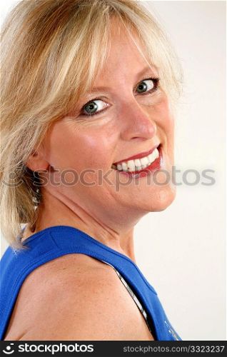 Head shot of smiling forty year old woman.