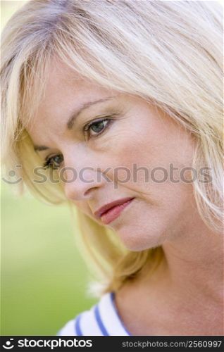 Head shot of woman thinking