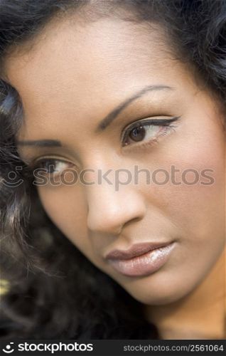Head shot of woman thinking