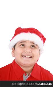 Head shot of young beauty Santa boy looking up to copy space and smiling