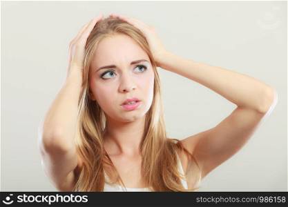 Headache, migraine and stress. Worried upset woman suffering from head pain