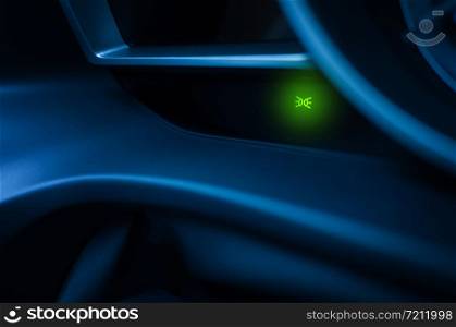 Headlight signal on a Car Dashboard.driving at night with your headlights