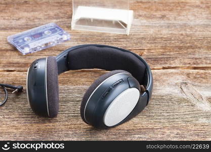 headphones on wood . big vintage headphones on aged wooden background