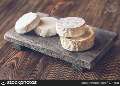 Heads of Camembert on the wooden board