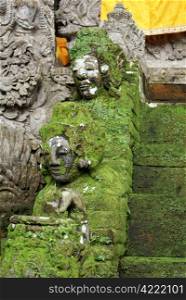 Heads of green demons on the staircase, Bali