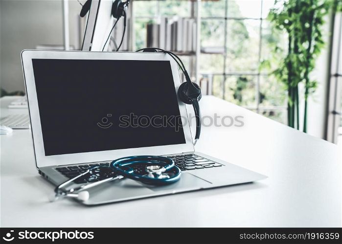 Headset and doctor equipment at clinic ready for actively support for patient by online video call . Concept of telehealth and telemedicine service .. Headset and doctor equipment at clinic ready for actively support for patient