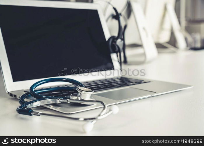 Headset and doctor equipment at clinic ready for actively support for patient by online video call . Concept of telehealth and telemedicine service .. Headset and doctor equipment at clinic ready for actively support for patient