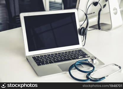 Headset and doctor equipment at clinic ready for actively support for patient by online video call . Concept of telehealth and telemedicine service .. Headset and doctor equipment at clinic ready for actively support for patient