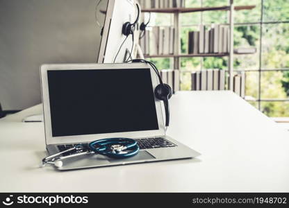 Headset and doctor equipment at clinic ready for actively support for patient by online video call . Concept of telehealth and telemedicine service .. Headset and doctor equipment at clinic ready for actively support for patient