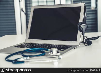 Headset and doctor equipment at clinic ready for actively support for patient by online video call . Concept of telehealth and telemedicine service .. Headset and doctor equipment at clinic ready for actively support for patient