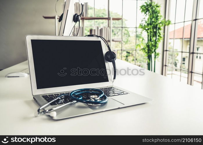 Headset and doctor equipment at clinic ready for actively support for patient by online video call . Concept of telehealth and telemedicine service .. Headset and doctor equipment at clinic ready for actively support for patient