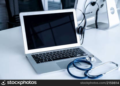 Headset and doctor equipment at clinic ready for actively support for patient by online video call . Concept of telehealth and telemedicine service .. Headset and doctor equipment at clinic ready for actively support for patient