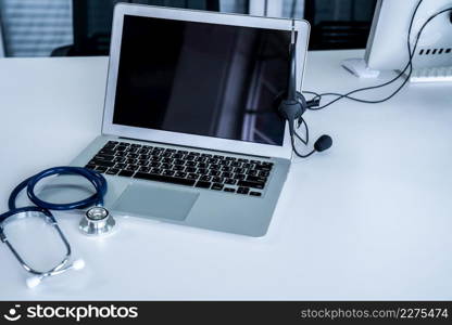 Headset and doctor equipment at clinic ready for actively support for patient by online video call . Concept of telehealth and telemedicine service .. Headset and doctor equipment at clinic ready for actively support for patient