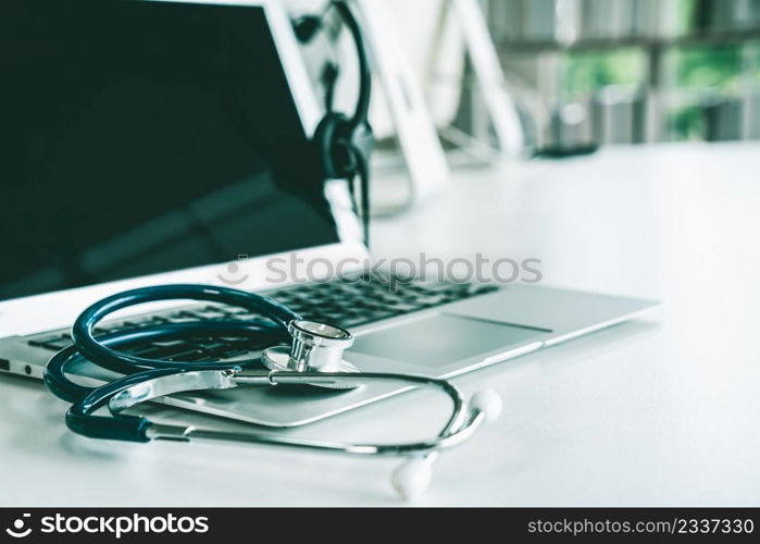 Headset and doctor equipment at clinic ready for actively support for patient by online video call . Concept of telehealth and telemedicine service .. Headset and doctor equipment at clinic ready for actively support for patient