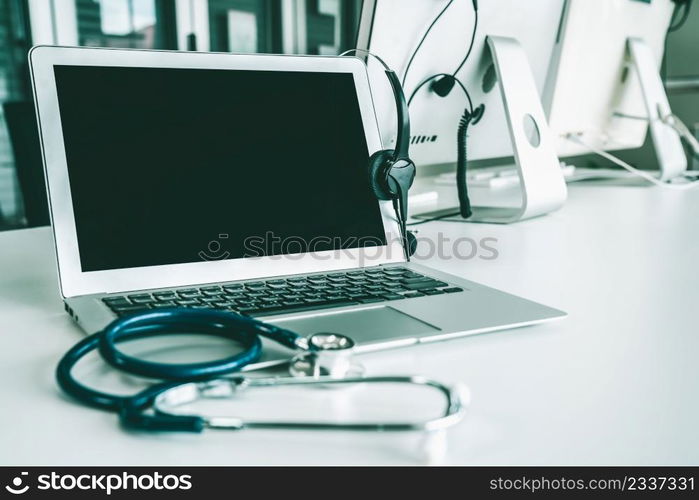 Headset and doctor equipment at clinic ready for actively support for patient by online video call . Concept of telehealth and telemedicine service .. Headset and doctor equipment at clinic ready for actively support for patient