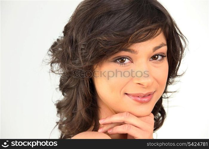 Headshot of a pretty brunette with bare shoulders