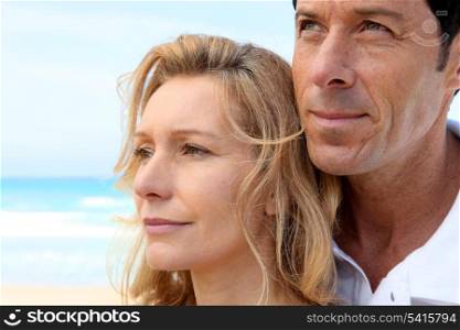 Headshot of couple by sea