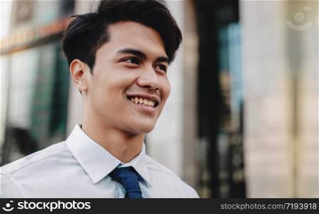 Headshot of Happy Urban Businessman in the City. Young Friendly Man
