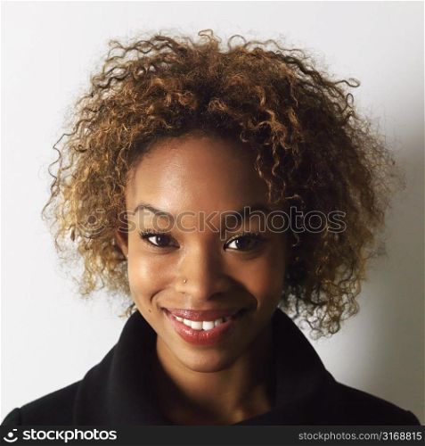 Headshot of pretty smiling young woman.