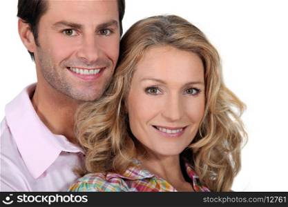 Headshot of smiling couple