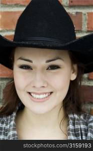 Headshot of woman in cowboy hat