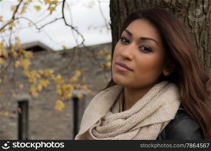 Headshot portrait of an attractive, fresh hispanic woman