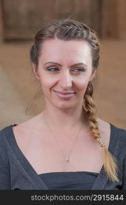 headshot portrait of the pretty brown haired women looking awai down