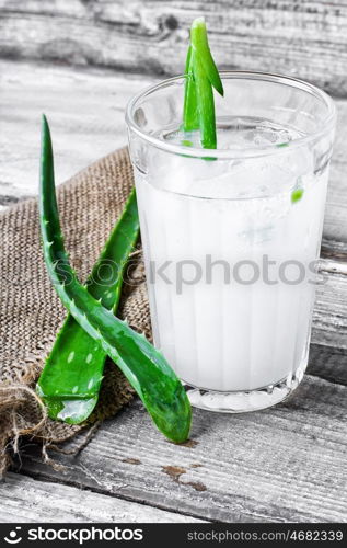 Healing drink with aloe. glass of medicinal drink sap from aloe leaf