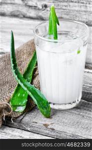 Healing drink with aloe. glass of medicinal drink sap from aloe leaf