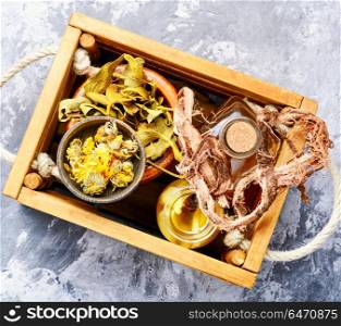 Healing herbs in wooden box. Natural herbal medicine,medicinal herbs and herbal medicinal tinctures.Natural herbs medicine