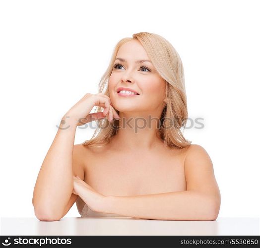 health and beauty concept - beautiful smiling woman touching her face