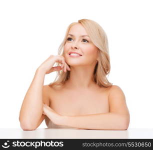 health and beauty concept - beautiful smiling woman touching her face