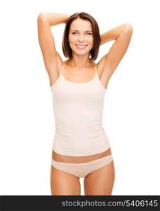 health and beauty concept - beautiful woman in beige cotton underwear