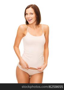 health and beauty concept - beautiful woman in beige cotton underwear. beautiful woman in beige cotton underwear