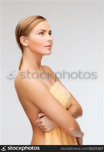 health and beauty concept - beautiful woman in towel