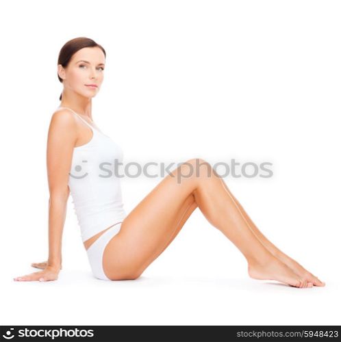 health and beauty concept - beautiful woman in white cotton underwear. beautiful woman in white cotton underwear
