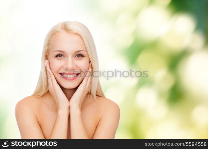 health and beauty concept - beautiful woman touching her face skin