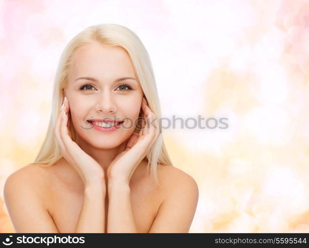 health and beauty concept - beautiful woman touching her face skin