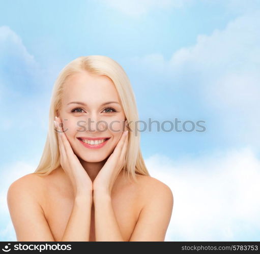 health and beauty concept - beautiful woman touching her face skin