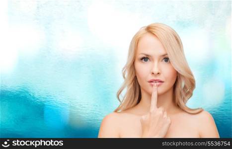 health and beauty concept - beautiful woman touching her lips